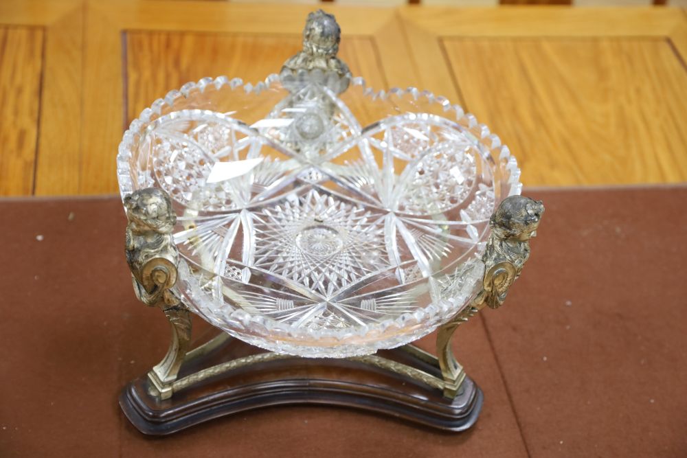 A 19th century silver plated figural centrepiece with deeply cut glass bowl, 34cm diameter